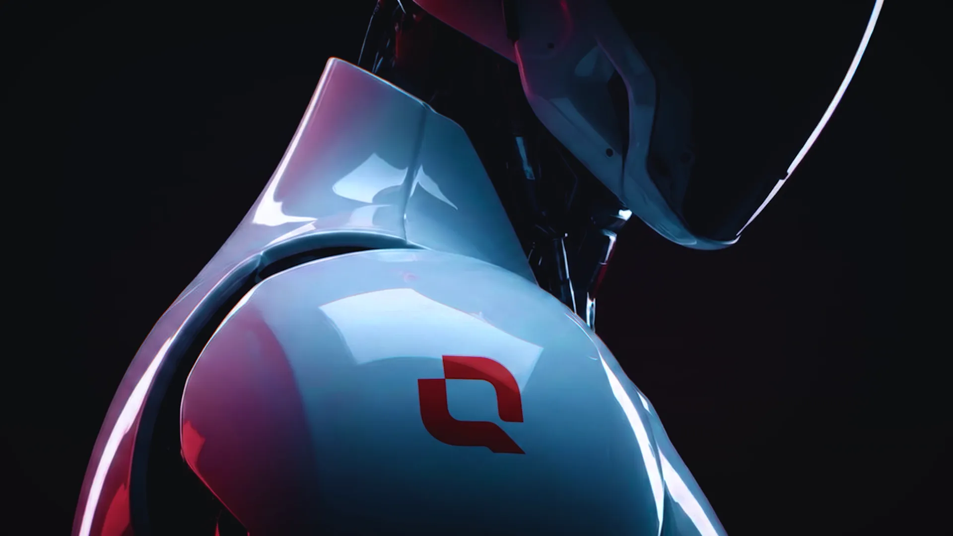 A sleek industrial robot powered by the Qolorlab Q-mark — chest core glows red, shoulder bears a matte red Qolorlab logo, signalling the system is alive.